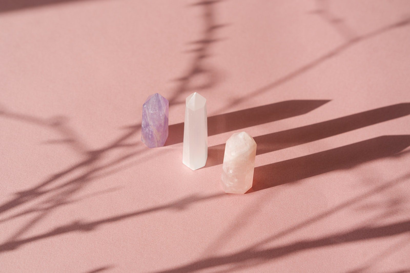 Stone Crystals Casting a Shadow on the White Surface